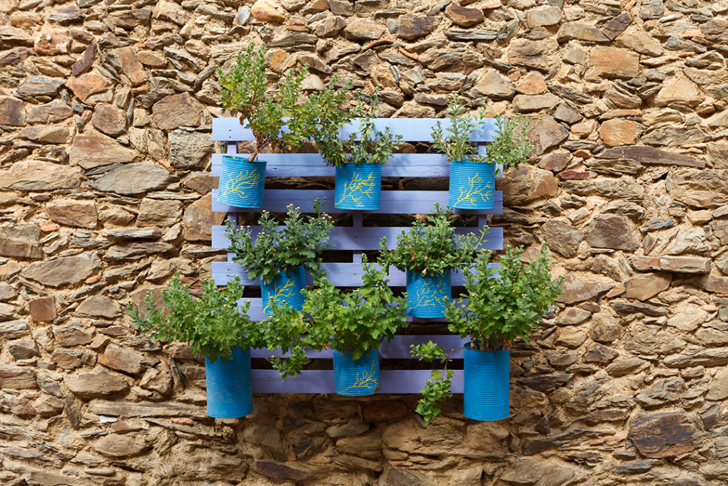 Containers on a pallet hanging from a wall